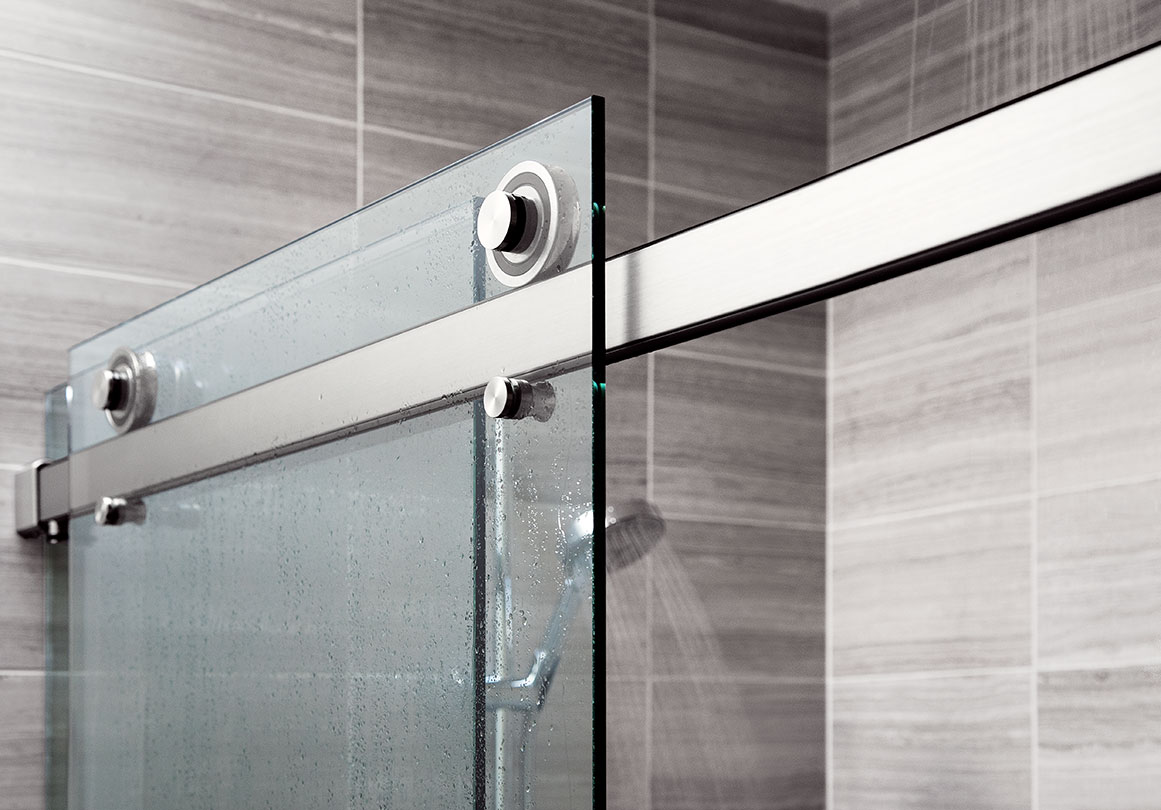Rorik sliding shower door system in Doppelganger Duplex, Portland, OR.  Shown in Alcove with Brushed Stainless finish.