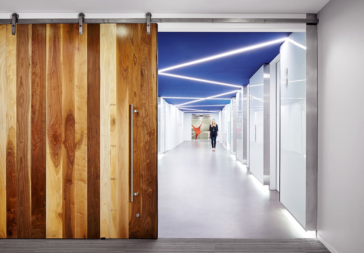 The Axel sliding door hardware system in Rise Interactive's Chicago, IL headquarters. Shown in Raw Steel.