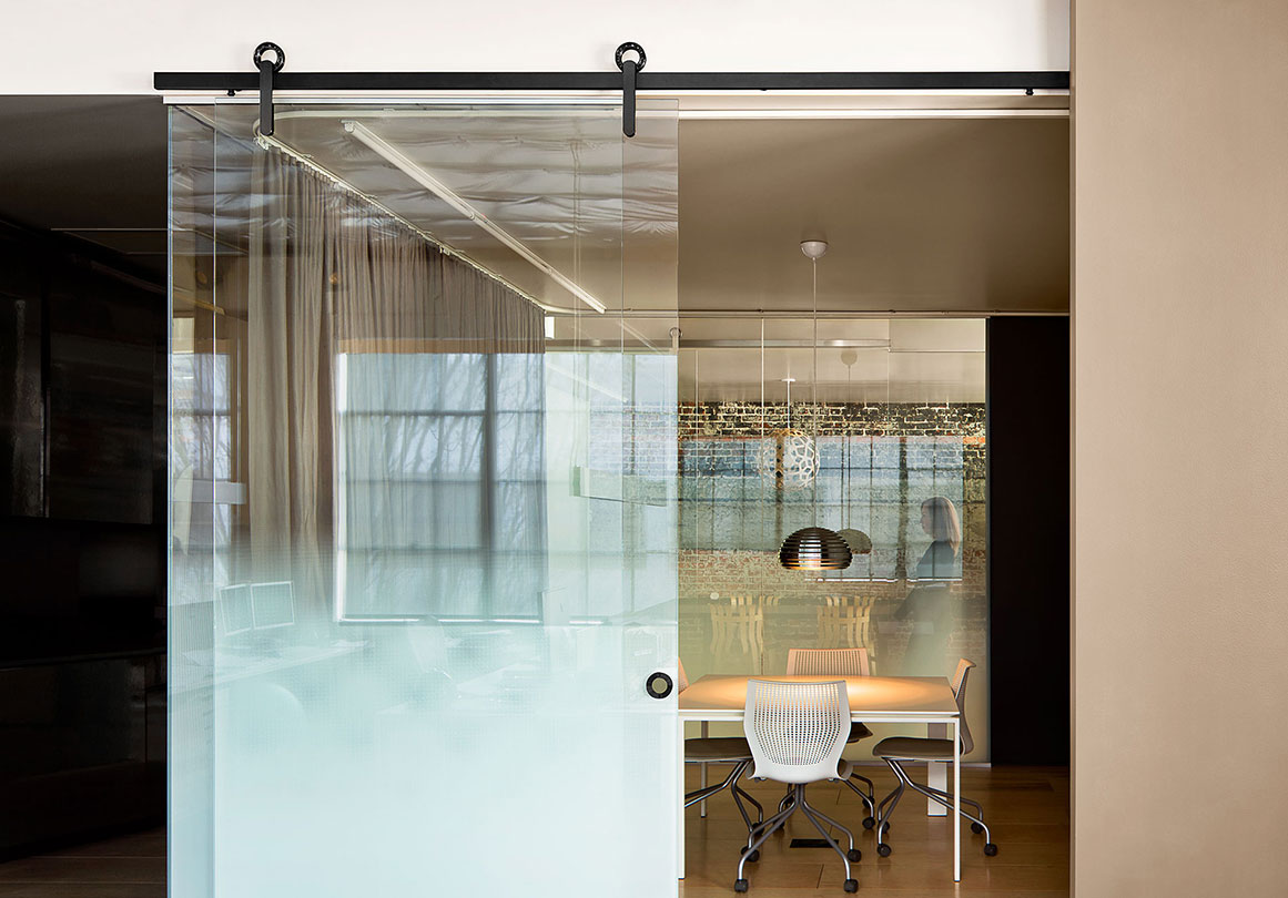 Sliding glass door with Krownlab modern sliding door hardware in office
