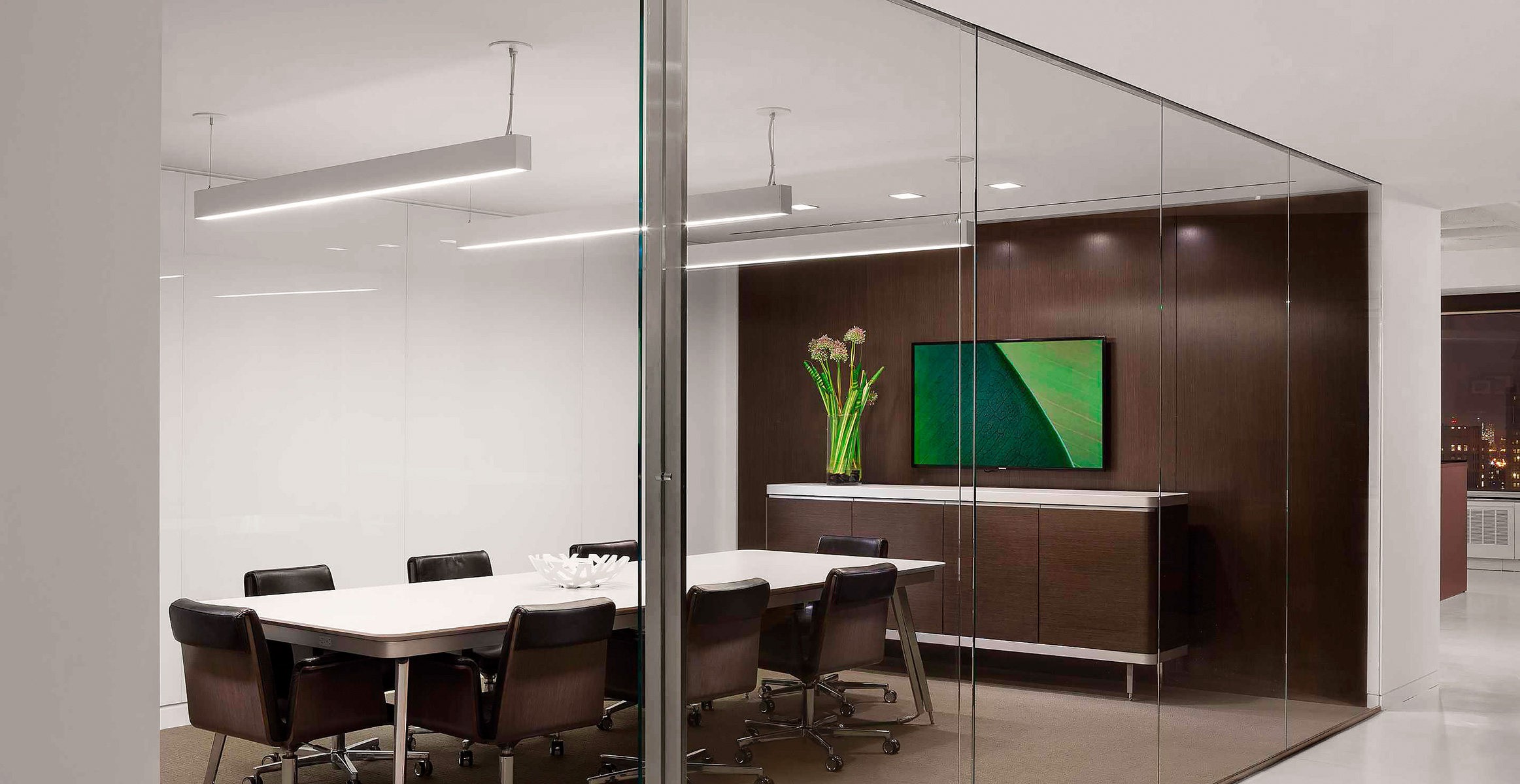 Glass conference room sliding doors with vertical stainless steel pulls