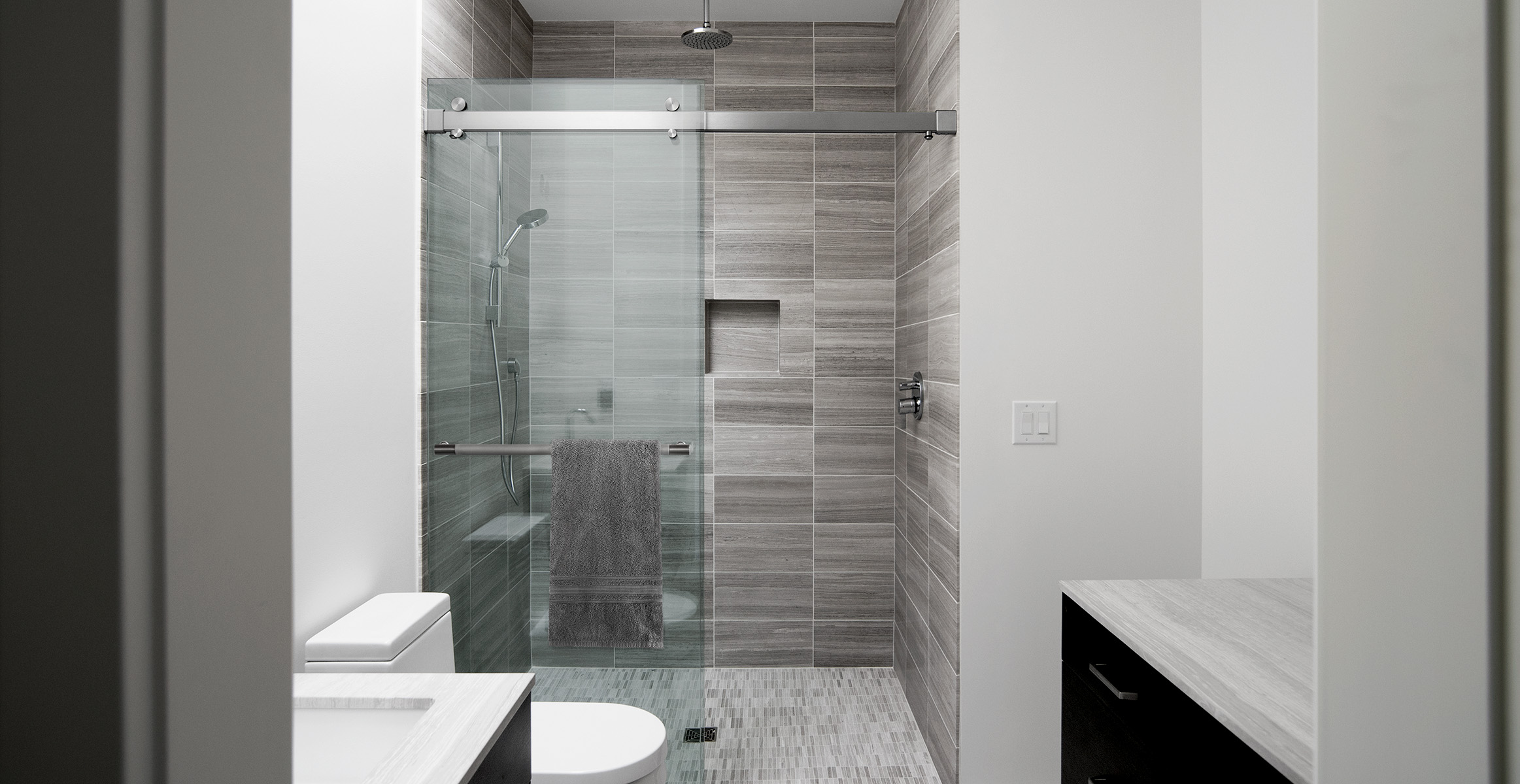 Premium towel bar for shower enclosure in Brushed Stainless finish.