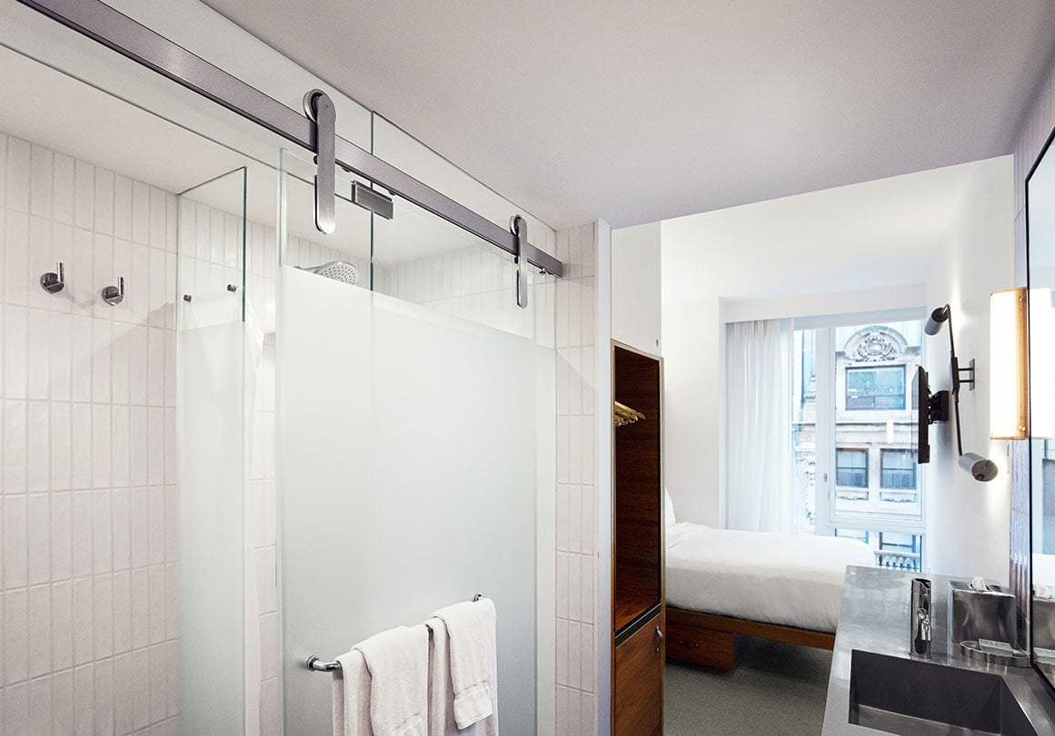 Krownlab modern sliding door hardware in brushed stainless finish for shower