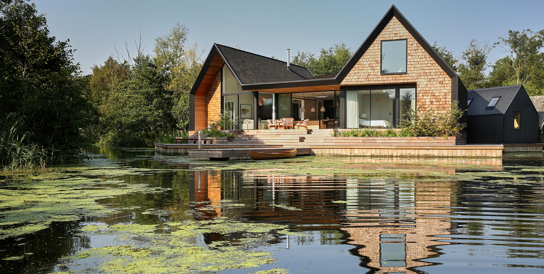 A vacation home in the Norfolk Broads featuring the Axel sliding door hardware from Krownlab