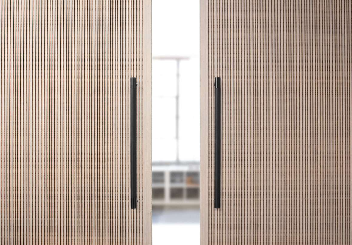 Kor Door Pull in Blaxk Stainless installed with Plyboo Bamboo Door.