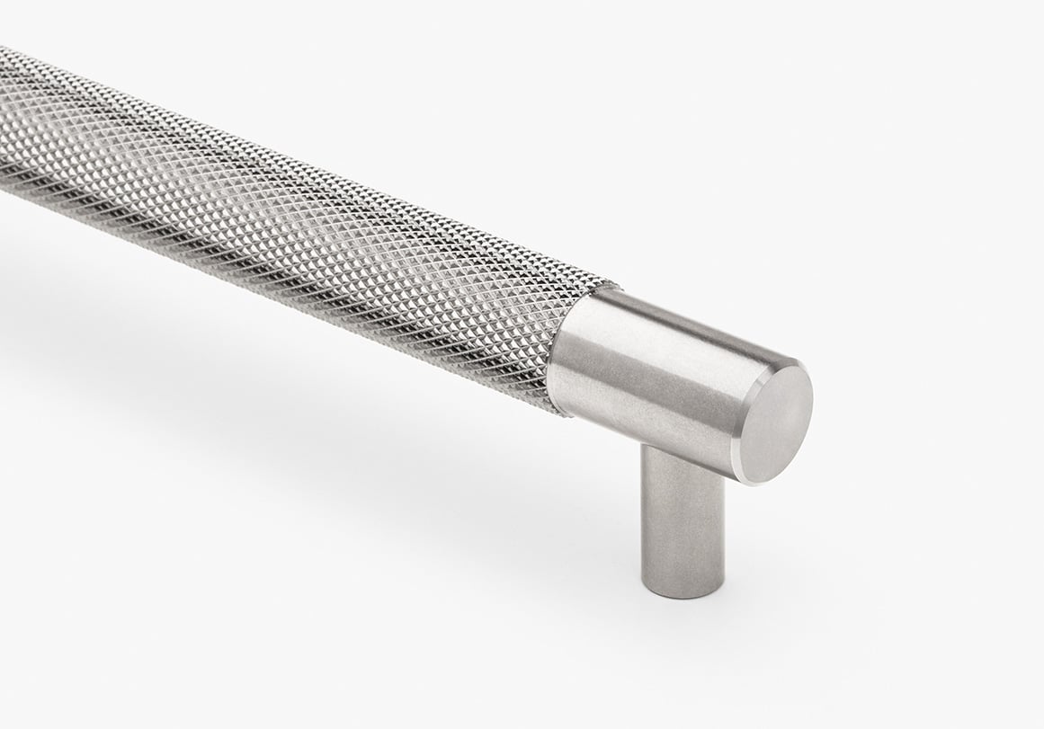 Modern cabinet pull hardware with knurled texture in brushed stainless finish by Krownlab.